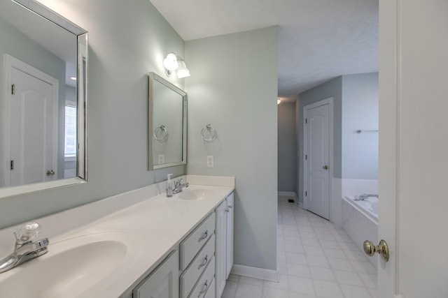 206 Sayre Ln, Murfreesboro, TN 37127 - full bathroom with double vanity, baseboards, a bath, and tile patterned flooring