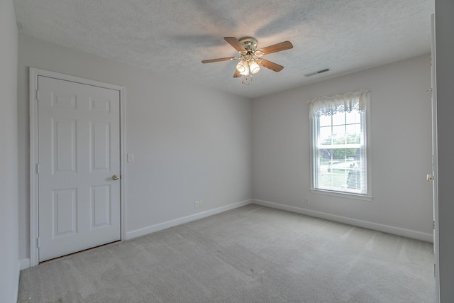 206 Sayre Ln, Murfreesboro, TN 37127 - unfurnished room featuring a textured ceiling, light carpet, a ceiling fan, and baseboards