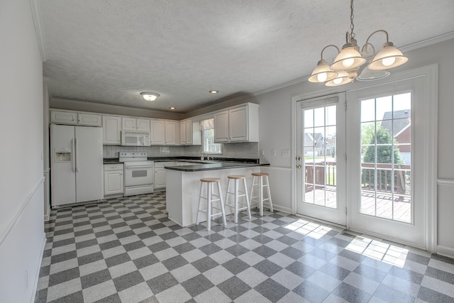 206 Sayre Ln, Murfreesboro, TN 37127 - kitchen featuring white appliances, plenty of natural light, dark floors, crown molding, and a textured ceiling