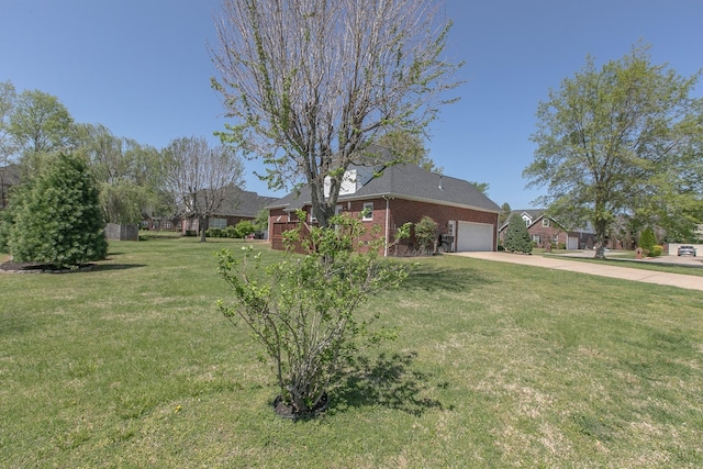 206 Sayre Ln, Murfreesboro, TN 37127 - view of property exterior with an attached garage, driveway, a yard, and brick siding