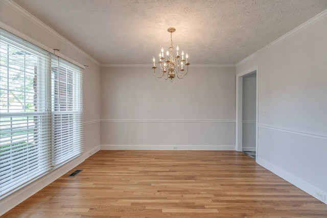 206 Sayre Ln, Murfreesboro, TN 37127 - spare room with healthy amount of natural light, a chandelier, light wood-type flooring, a textured ceiling, and crown molding