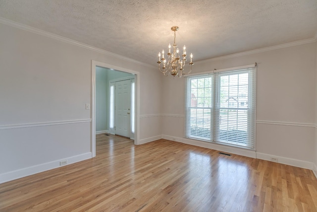 206 Sayre Ln, Murfreesboro, TN 37127 - unfurnished room with a chandelier, a textured ceiling, baseboards, light wood-style flooring, and crown molding