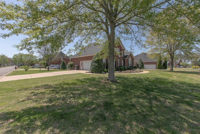 206 Sayre Ln, Murfreesboro, TN 37127 - view of home's exterior featuring an attached garage, concrete driveway, a lawn, and brick siding