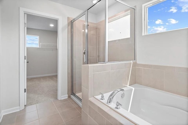 2502 Beverly Gail Rd, Pleasant View, TN 37146 - bathroom featuring a stall shower, healthy amount of natural light, a bath, and a walk in closet