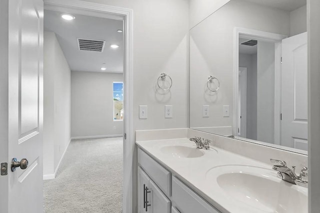 2502 Beverly Gail Rd, Pleasant View, TN 37146 - bathroom with double vanity, baseboards, and recessed lighting
