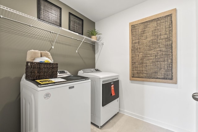 2502 Beverly Gail Rd, Pleasant View, TN 37146 - washroom with washer and dryer, baseboards, and light tile patterned floors