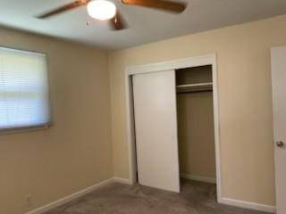 904 Apple Valley Rd, Madison, TN 37115 - unfurnished bedroom featuring a closet, baseboards, a ceiling fan, and carpet