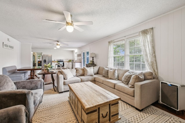 979 S Main St S, Eagleville, TN 37060 - living area with ceiling fan, a textured ceiling, and light wood-type flooring