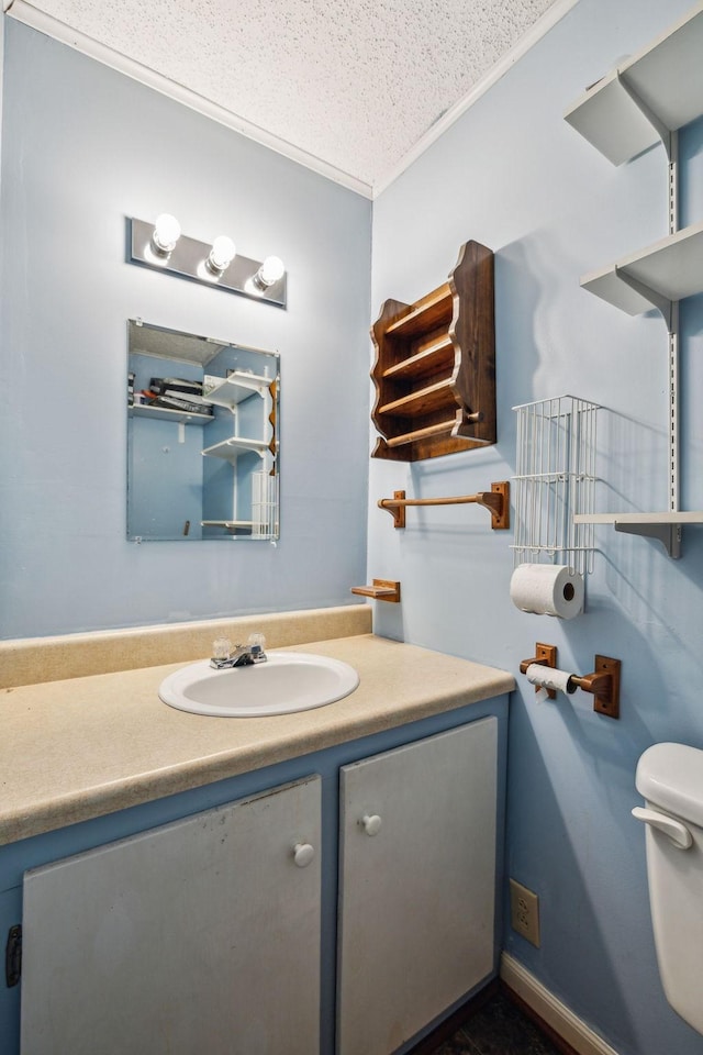 979 S Main St S, Eagleville, TN 37060 - bathroom featuring vanity, toilet, a textured ceiling, and crown molding
