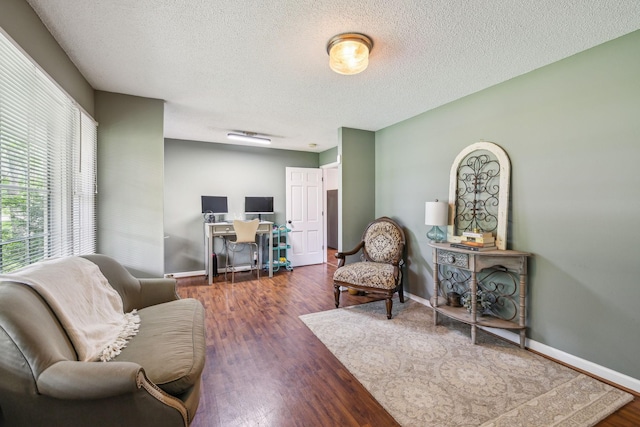 979 S Main St S, Eagleville, TN 37060 - living area with a textured ceiling, wood finished floors, and baseboards