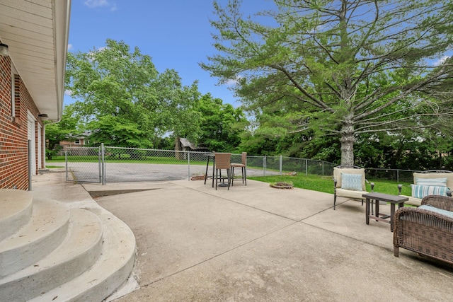 979 S Main St S, Eagleville, TN 37060 - fenced backyard with a patio area, a fire pit, a gate, and view of wooded area