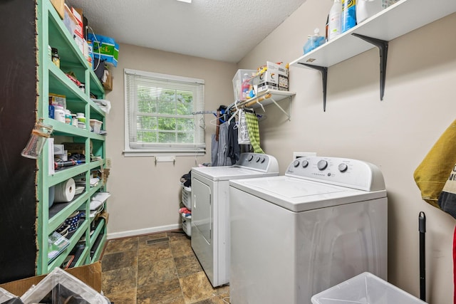 979 S Main St S, Eagleville, TN 37060 - washroom with washer and dryer, stone finish flooring, a textured ceiling, and baseboards