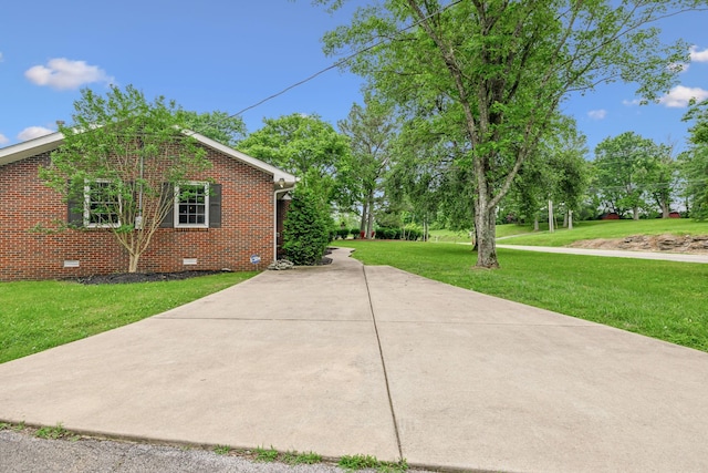979 S Main St S, Eagleville, TN 37060 - view of side of property featuring crawl space, a yard, and brick siding