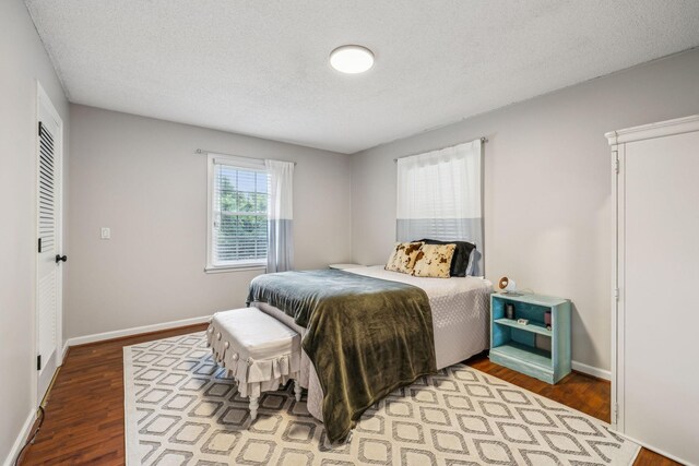979 S Main St S, Eagleville, TN 37060 - bedroom featuring wood finished floors, baseboards, and a textured ceiling