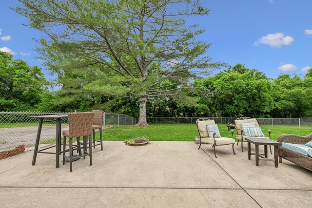 979 S Main St S, Eagleville, TN 37060 - view of patio featuring an outdoor fire pit and view of wooded area