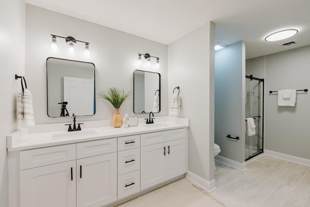 1405 SE Broad St, Murfreesboro, TN 37130 - bathroom with double vanity, a shower stall, toilet, and baseboards