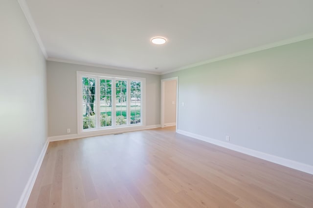 1405 SE Broad St, Murfreesboro, TN 37130 - spare room featuring crown molding, light wood finished floors, and baseboards