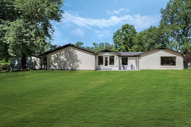 1412 Knox Valley Dr, Brentwood, TN 37027 - rear view of property featuring a lawn and a patio area