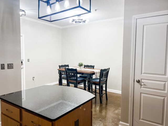 1803 Broadway Unit 509, Nashville, TN 37203 - dining area featuring finished concrete floors, ornamental molding, baseboards, and a chandelier