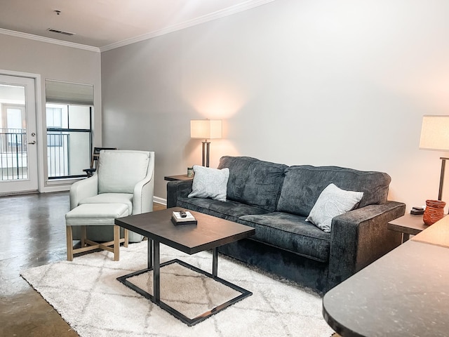 1803 Broadway Unit 509, Nashville, TN 37203 - living area featuring concrete flooring, ornamental molding, and baseboards
