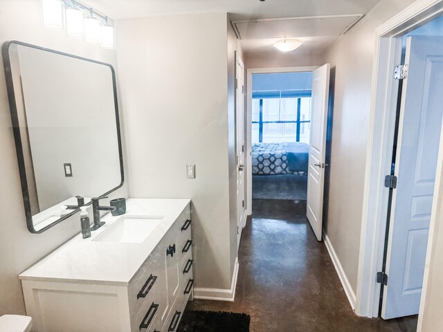 1803 Broadway Unit 509, Nashville, TN 37203 - bathroom featuring concrete flooring, baseboards, and vanity