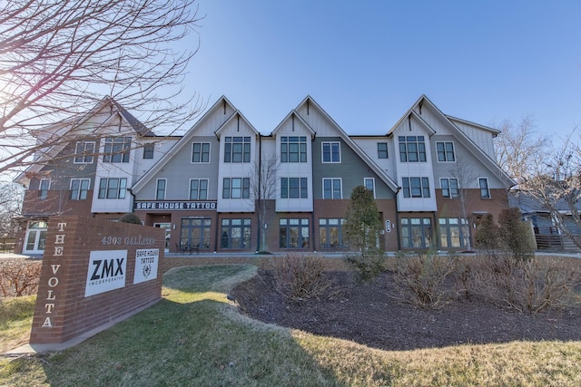 4303 Gallatin Pike Unit 206, Nashville, TN 37216 - view of front facade with board and batten siding and a front lawn