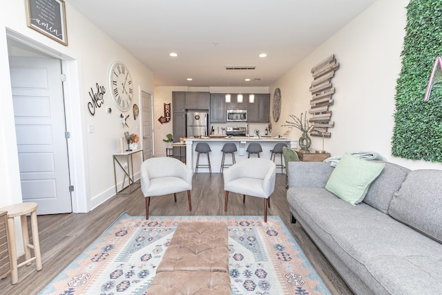 4303 Gallatin Pike Unit 206, Nashville, TN 37216 - living room featuring wood finished floors, recessed lighting, and baseboards