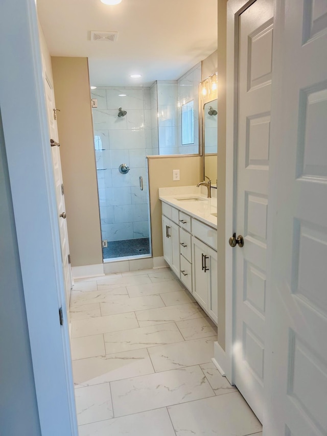 5930 Carl Pl, Nashville, TN 37209 - bathroom with marble look tile flooring, vanity, and a stall shower