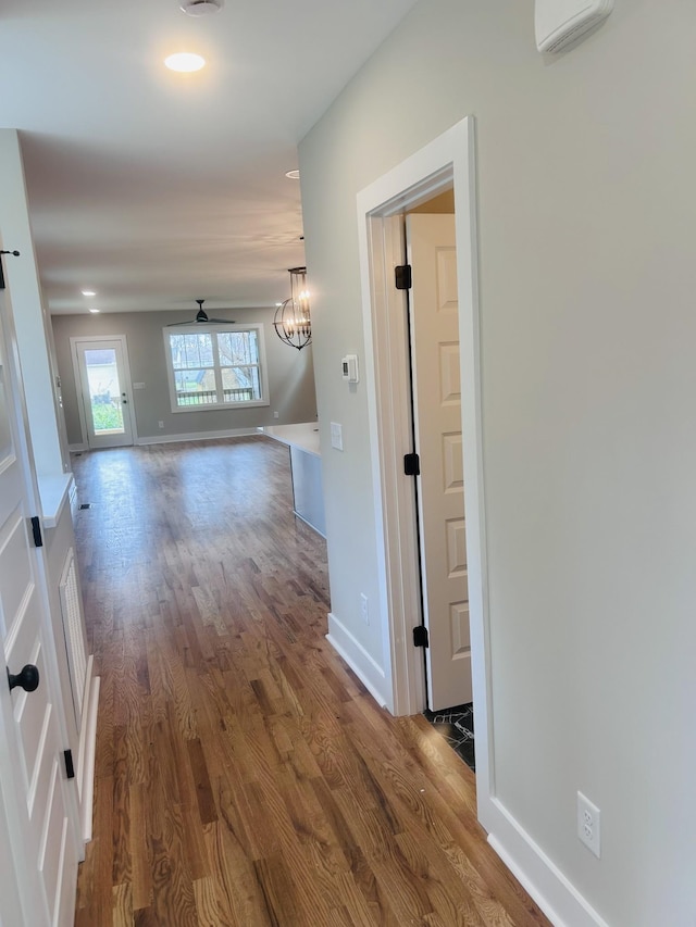 5930 Carl Pl, Nashville, TN 37209 - hall with dark wood finished floors, baseboards, recessed lighting, and a chandelier
