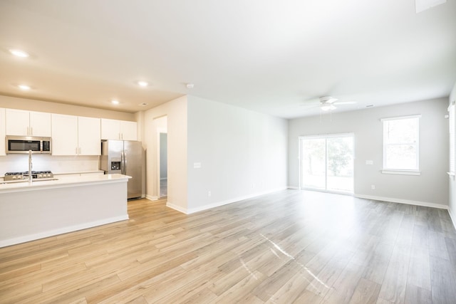 441 Golden Meadow Ln, Hendersonville, TN 37075 - unfurnished living room with a ceiling fan, light wood finished floors, recessed lighting, and baseboards