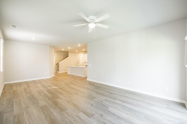 441 Golden Meadow Ln, Hendersonville, TN 37075 - unfurnished living room with stairway, light wood-type flooring, recessed lighting, ceiling fan, and baseboards