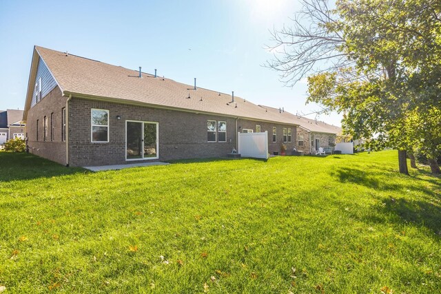 441 Golden Meadow Ln, Hendersonville, TN 37075 - rear view of property featuring brick siding, a lawn, and a shingled roof