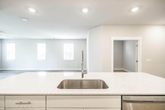 441 Golden Meadow Ln, Hendersonville, TN 37075 - kitchen featuring dishwasher, a sink, open floor plan, light stone counters, and healthy amount of natural light