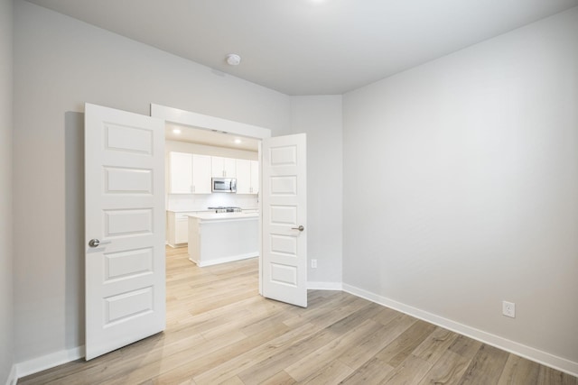441 Golden Meadow Ln, Hendersonville, TN 37075 - spare room with light wood-style flooring, baseboards, and a smoke detector