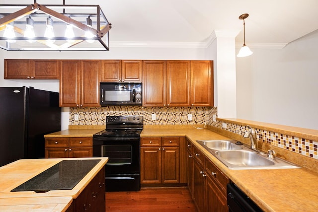 735 Tulip Grove Rd Unit 325, Hermitage, TN 37076 - kitchen featuring black appliances, a sink, ornamental molding, dark wood-style flooring, and light countertops