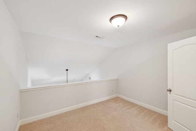 735 Tulip Grove Rd Unit 325, Hermitage, TN 37076 - spare room with vaulted ceiling, baseboards, and light colored carpet