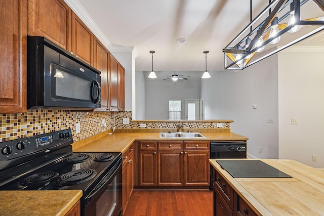 735 Tulip Grove Rd Unit 325, Hermitage, TN 37076 - kitchen featuring black appliances, a sink, backsplash, dark wood finished floors, and light countertops