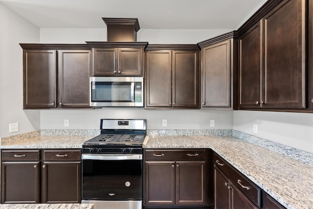 1339 Raden Dr, Lebanon, TN 37087 - kitchen with appliances with stainless steel finishes and dark brown cabinetry