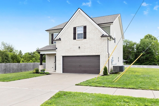 1339 Raden Dr, Lebanon, TN 37087 - view of front facade with an attached garage, central AC, brick siding, driveway, and a shingled roof