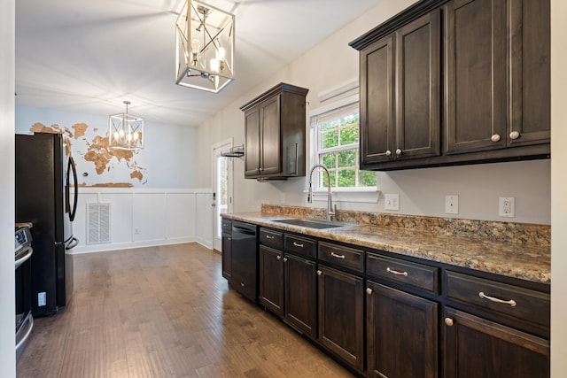 190 Twin Ct, Woodbury, TN 37190 - kitchen with a chandelier, a sink, black appliances, dark brown cabinets, and dark wood-style flooring