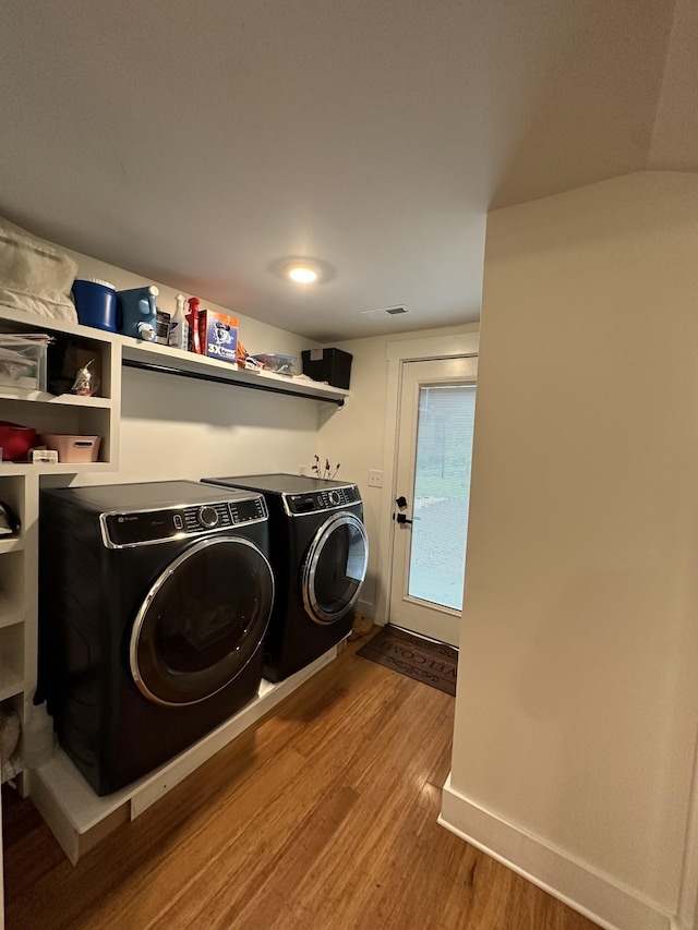 379 Thompson Ln, Tracy City, TN 37387 - washroom with washer and clothes dryer, wood finished floors, and baseboards