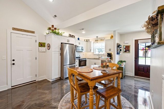 200 Nichols Dr, Woodbury, TN 37190 - dining area featuring plenty of natural light, baseboards, vaulted ceiling, dark marble finish floors, and recessed lighting