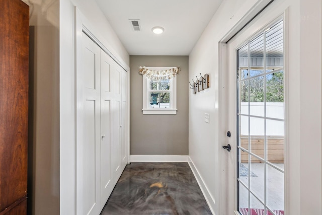 200 Nichols Dr, Woodbury, TN 37190 - doorway to outside featuring baseboards and concrete floors