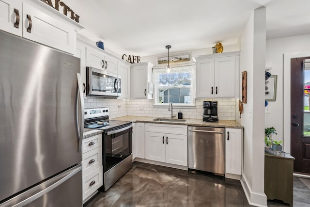 200 Nichols Dr, Woodbury, TN 37190 - kitchen with appliances with stainless steel finishes, a sink, backsplash, and white cabinetry