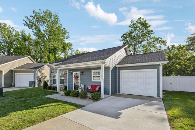 200 Nichols Dr, Woodbury, TN 37190 - view of front of home featuring a garage, concrete driveway, a porch, and roof with shingles