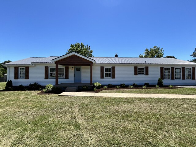 1371 Pomona Rd, Dickson, TN 37055 - single story home featuring covered porch, a front yard, and metal roof