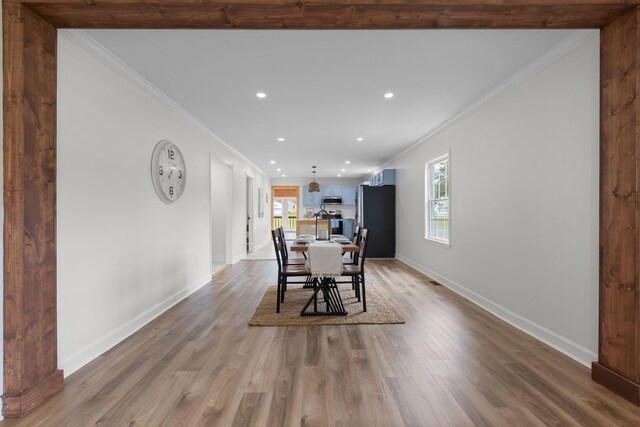 1371 Pomona Rd, Dickson, TN 37055 - dining area featuring crown molding, recessed lighting, wood finished floors, and baseboards