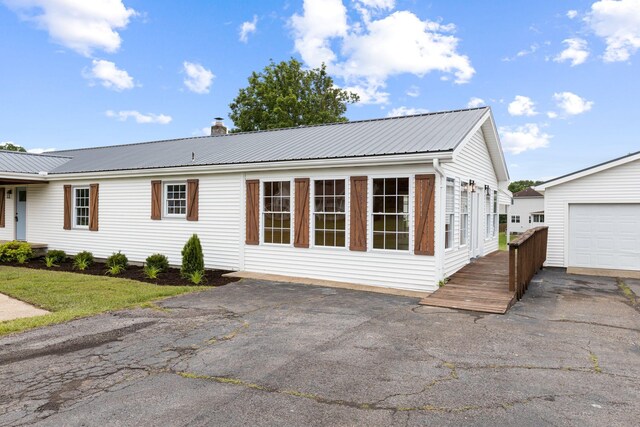 1371 Pomona Rd, Dickson, TN 37055 - view of front of home featuring metal roof and a chimney