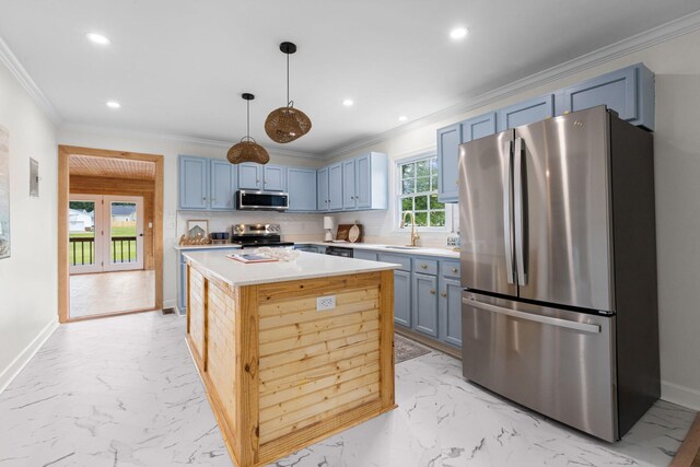 1371 Pomona Rd, Dickson, TN 37055 - kitchen featuring stainless steel appliances, light marble finish flooring, a kitchen island, recessed lighting, and crown molding
