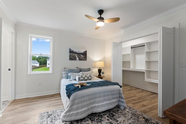 1371 Pomona Rd, Dickson, TN 37055 - bedroom with crown molding, wood finished floors, baseboards, and a ceiling fan